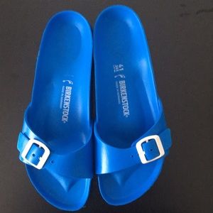 Gently worn blue Birkenstock sandals